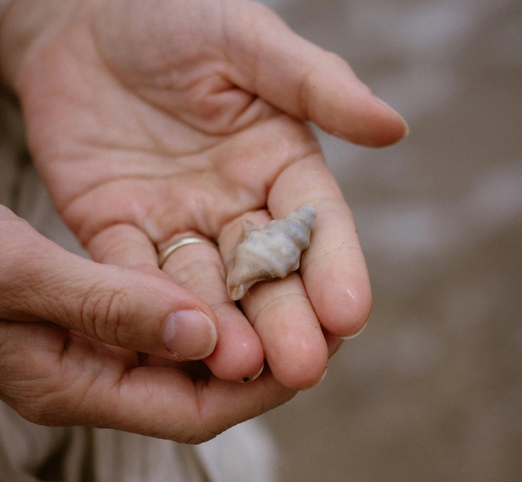 Hands holding a pet memorial ash fragment
